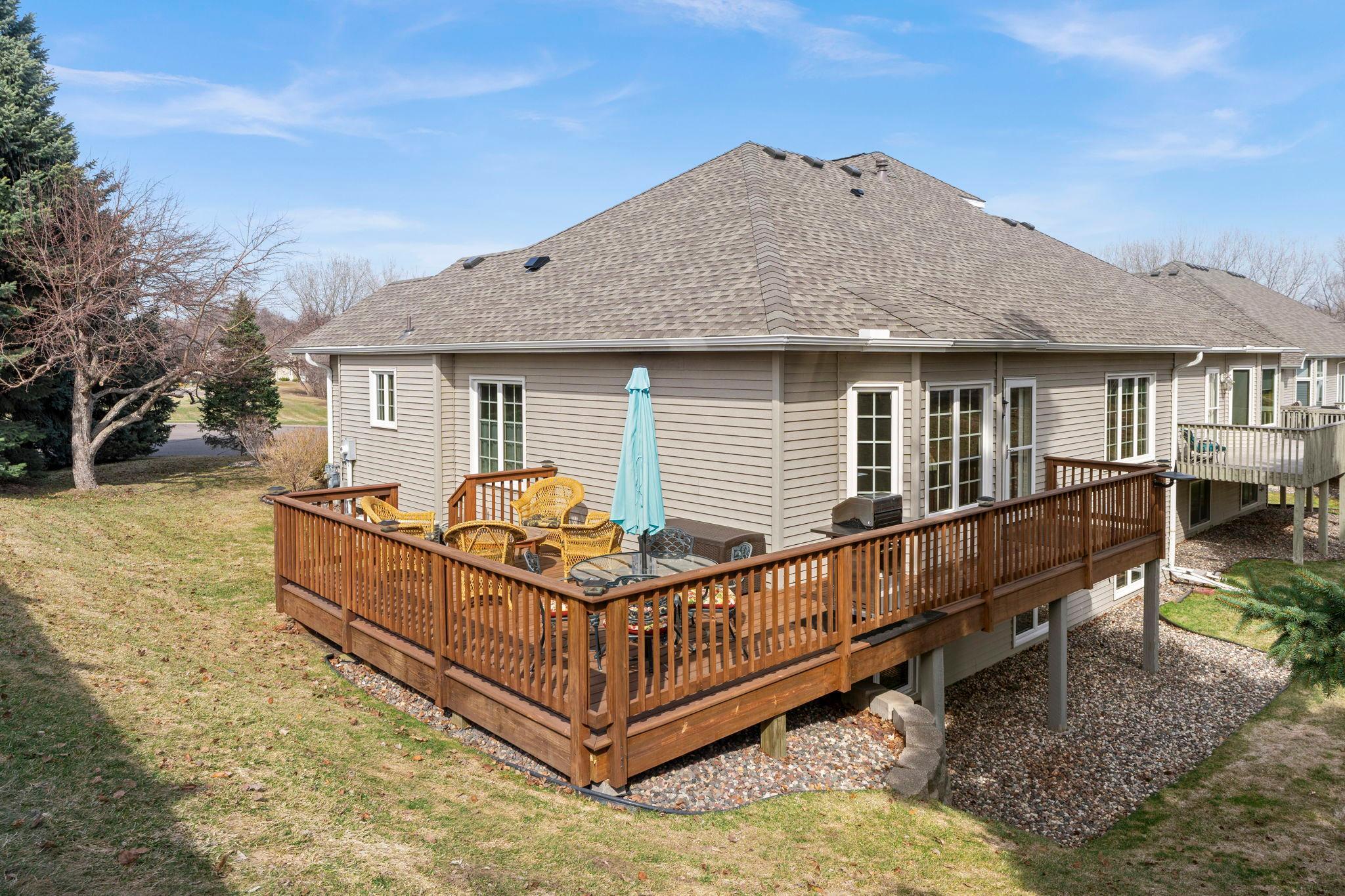 It overlooks peaceful greenspace and features a privacy wall that helps to create a serene setting.