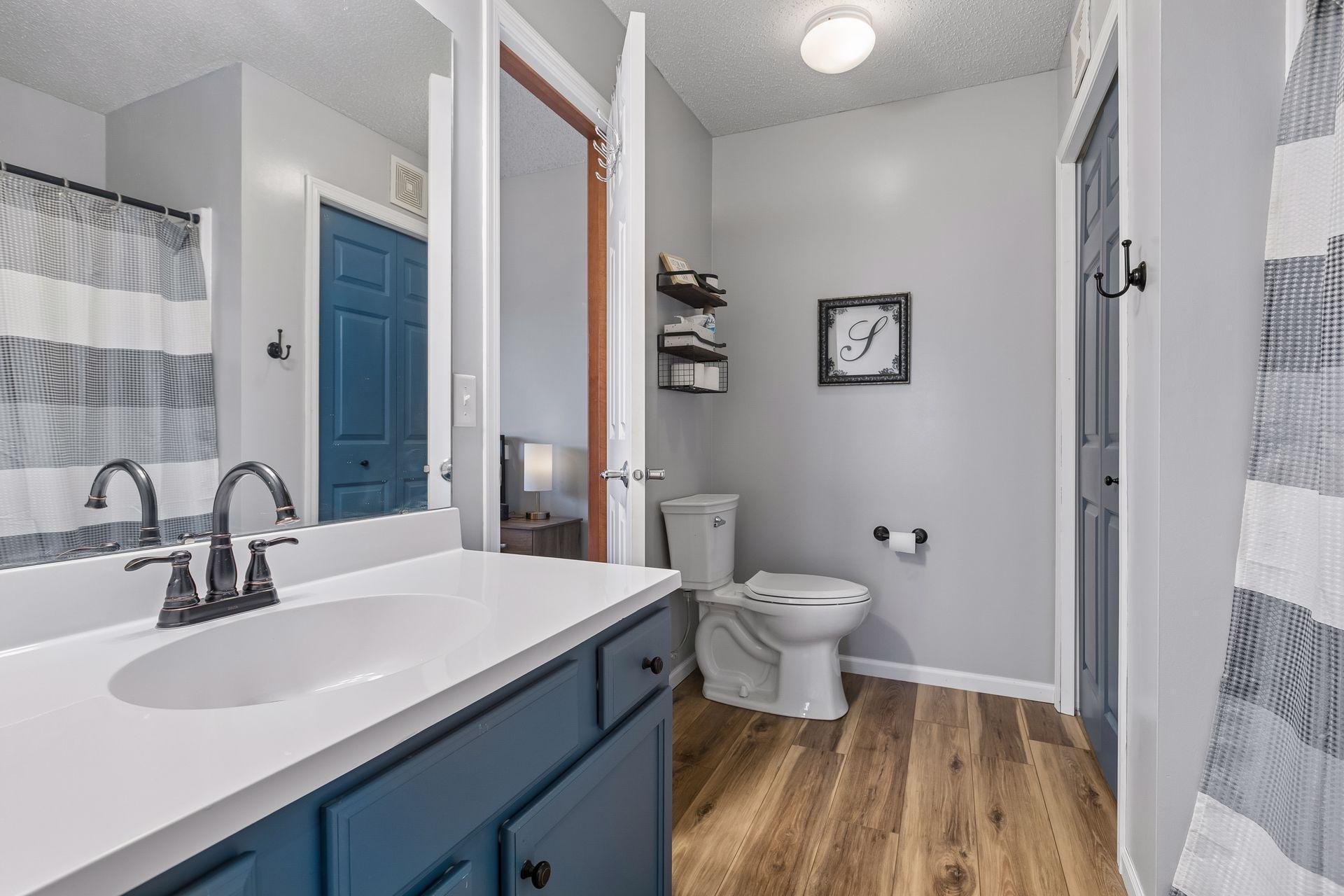 Refreshed upper level full bath with new flooring, shower surround and updated vanity.