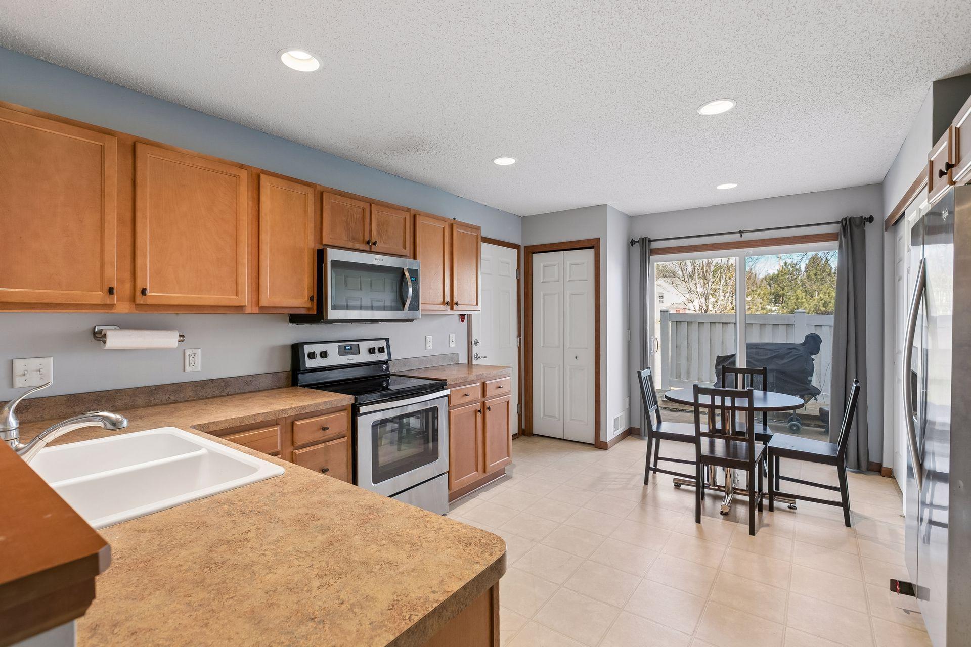 Large eat in kitchen with ample cabinet and counter space.