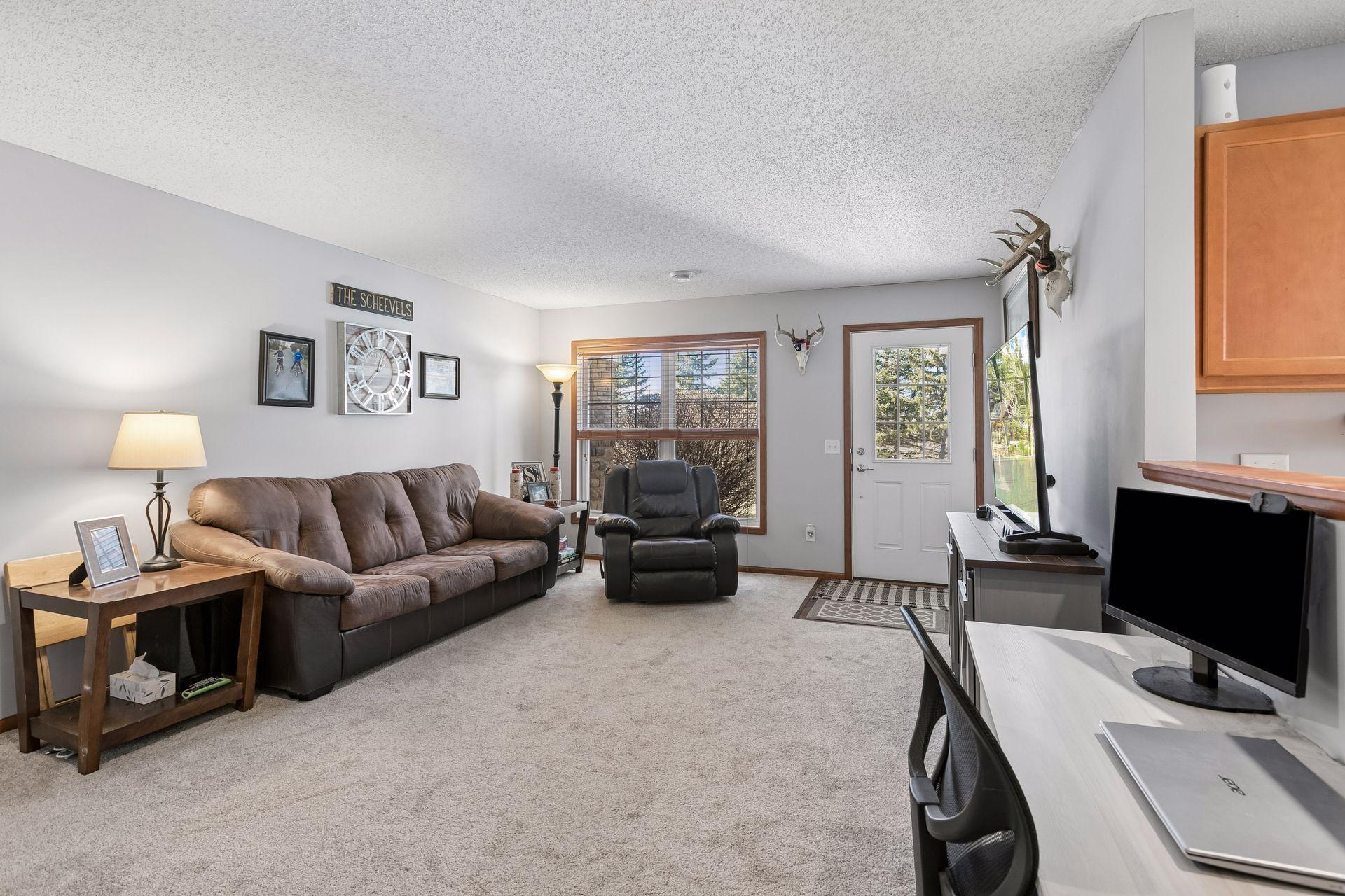 Large front window, and glass pane door let in loads of natural light.