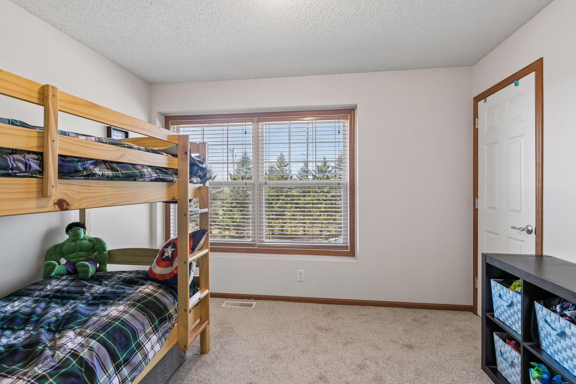 Second upper level bedroom with large closet.