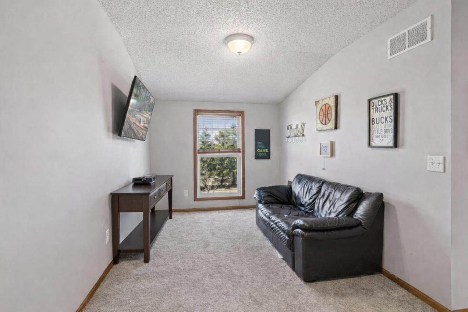 Upper level loft/ flex space. Perfect for additional living space, home office or hobby room.