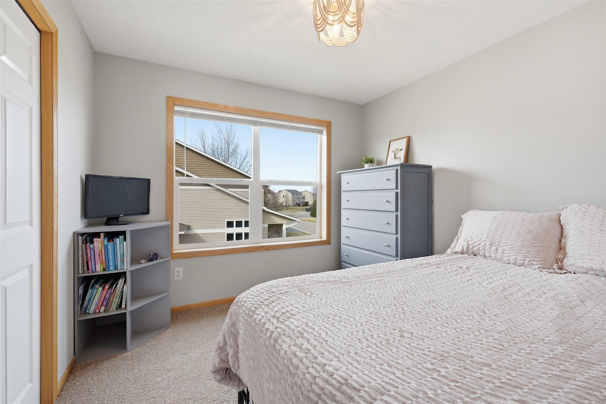 Bright and freshly painted second bedroom on the upper level