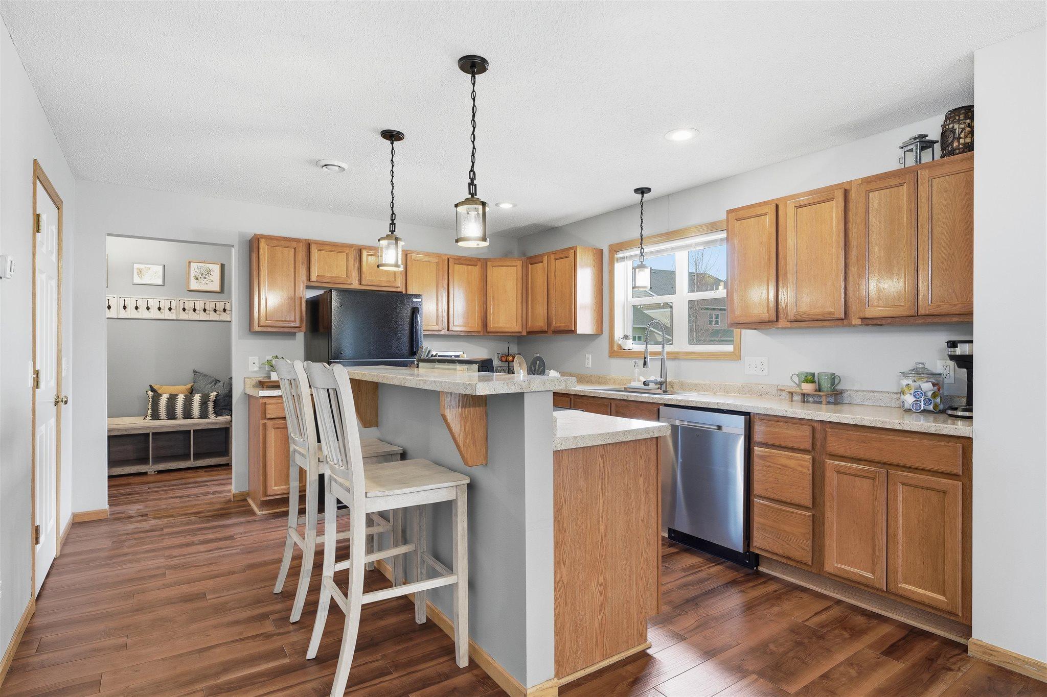 The kitchen offers the perfect blend of function and style with an oversized center island complete with additional seating