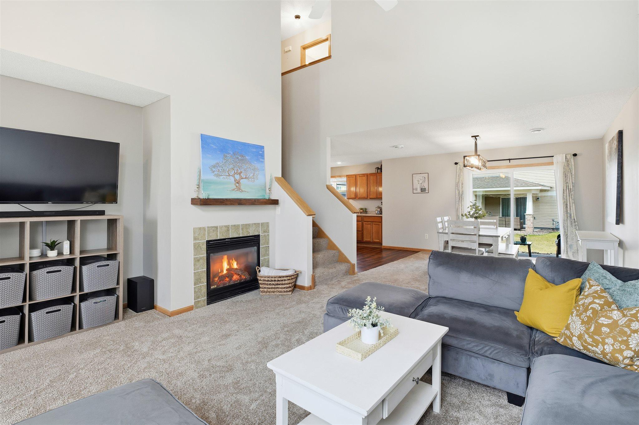 Gather and relax in the inviting living area, centered around a cozy fireplace!