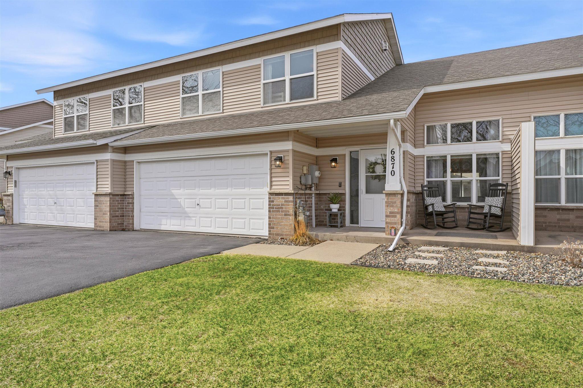 Welcome to 6870 99th Street S, relax and unwind in this south-facing townhome with scenic green space just beyond your backyard!