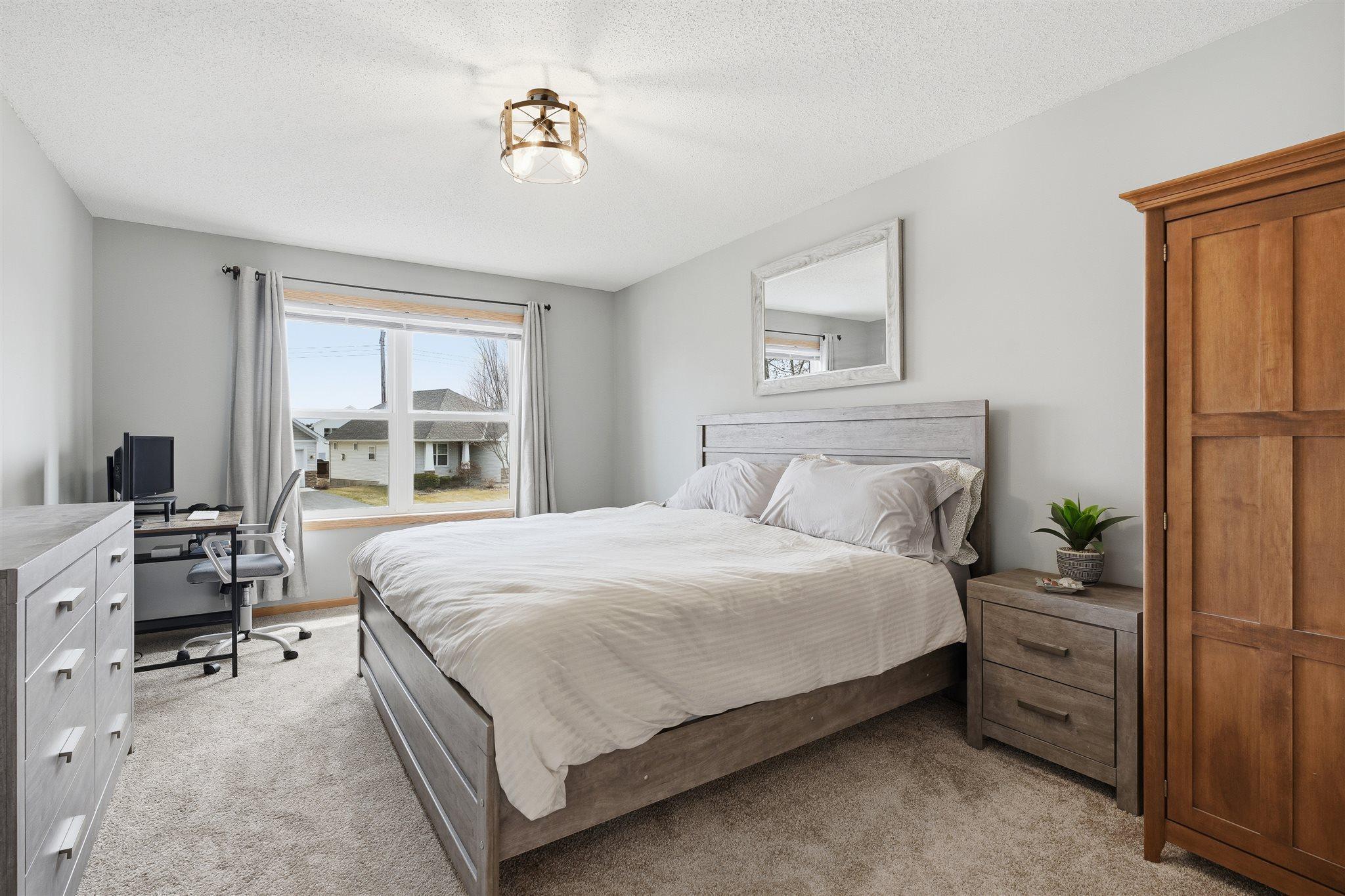 Retreat to a spacious primary suite complete with a walk-in closet and an expansive private bathroom