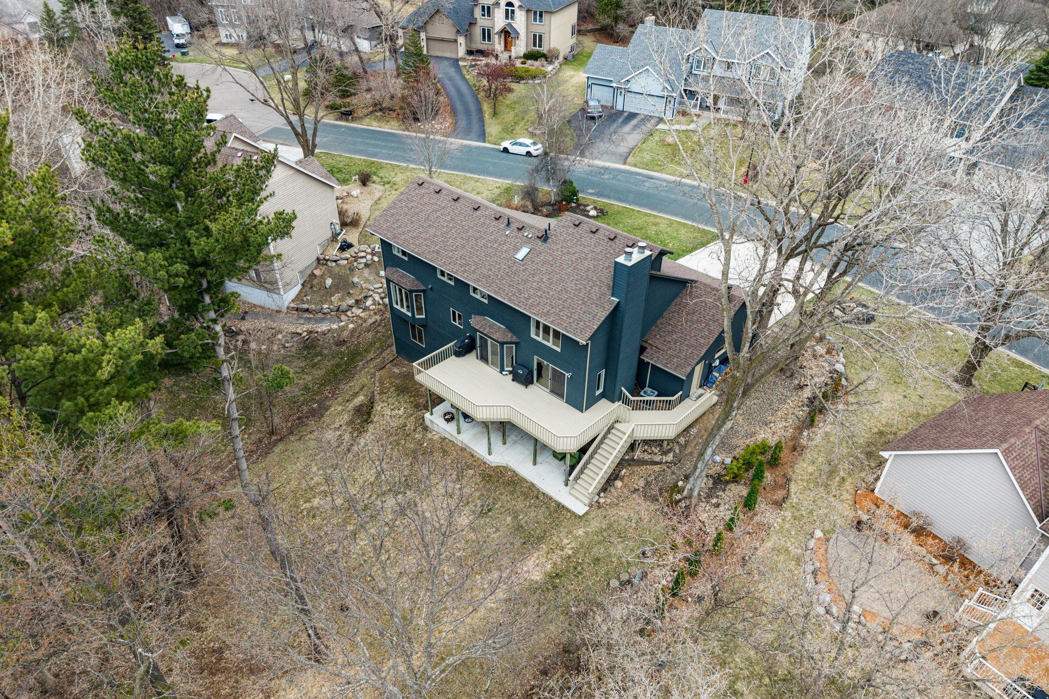 New concrete patio under the deck and freshly painted deck !