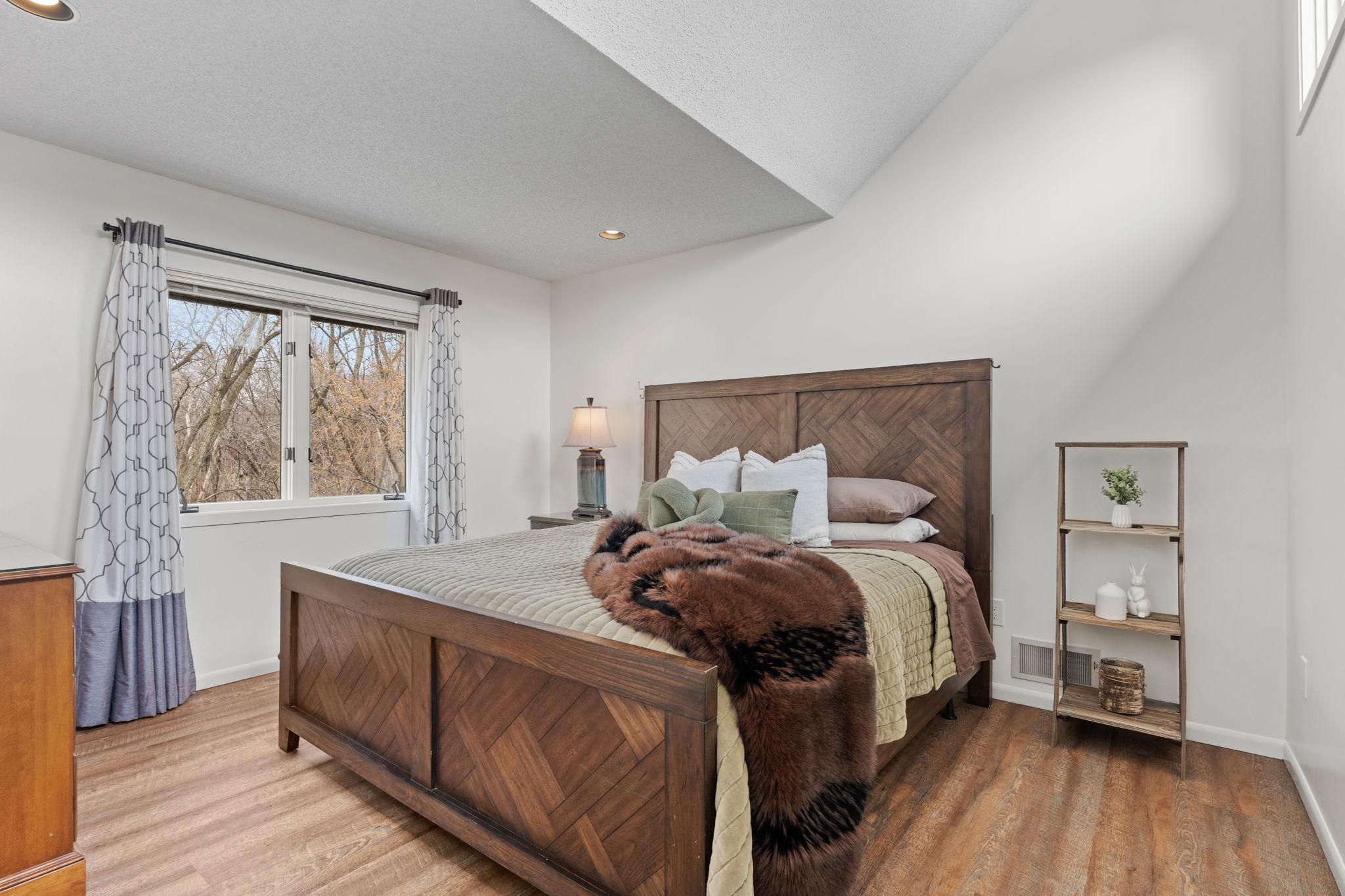 Bedroom #2 with vaulted ceiling and transom windows for extra light