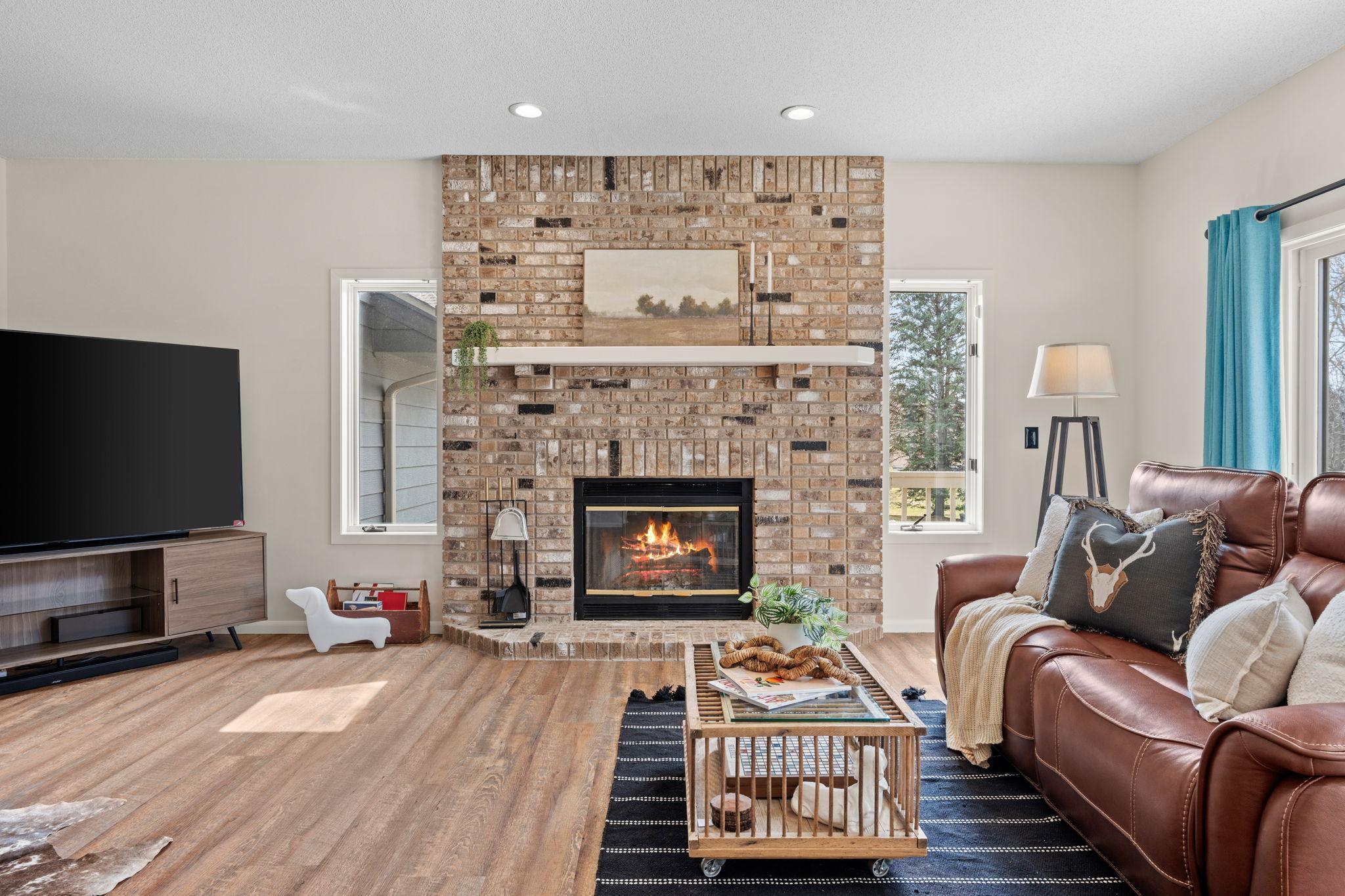 Family Room with cozy brick fireplace