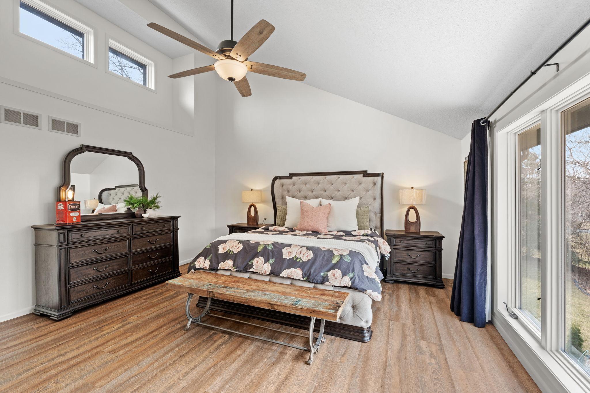 Primary suite with vaulted ceilings and fresh paint.