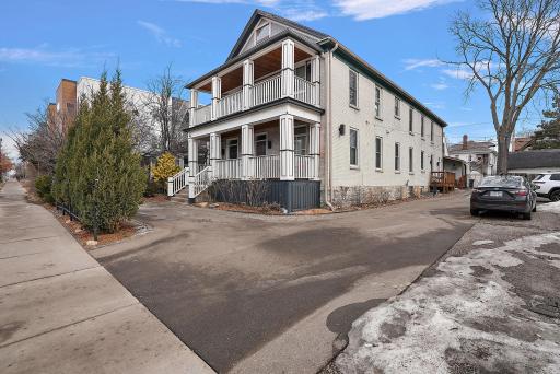 Paved lot, side elevation, follow driveway to other unit entrances