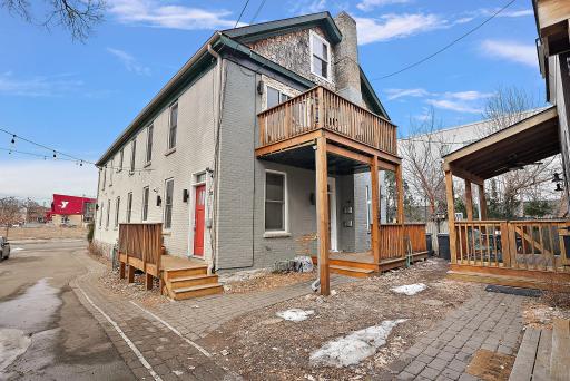 2E Exterior Entrance (red door), upper balcony for 4E, entry and deck for "Cherry Suite"