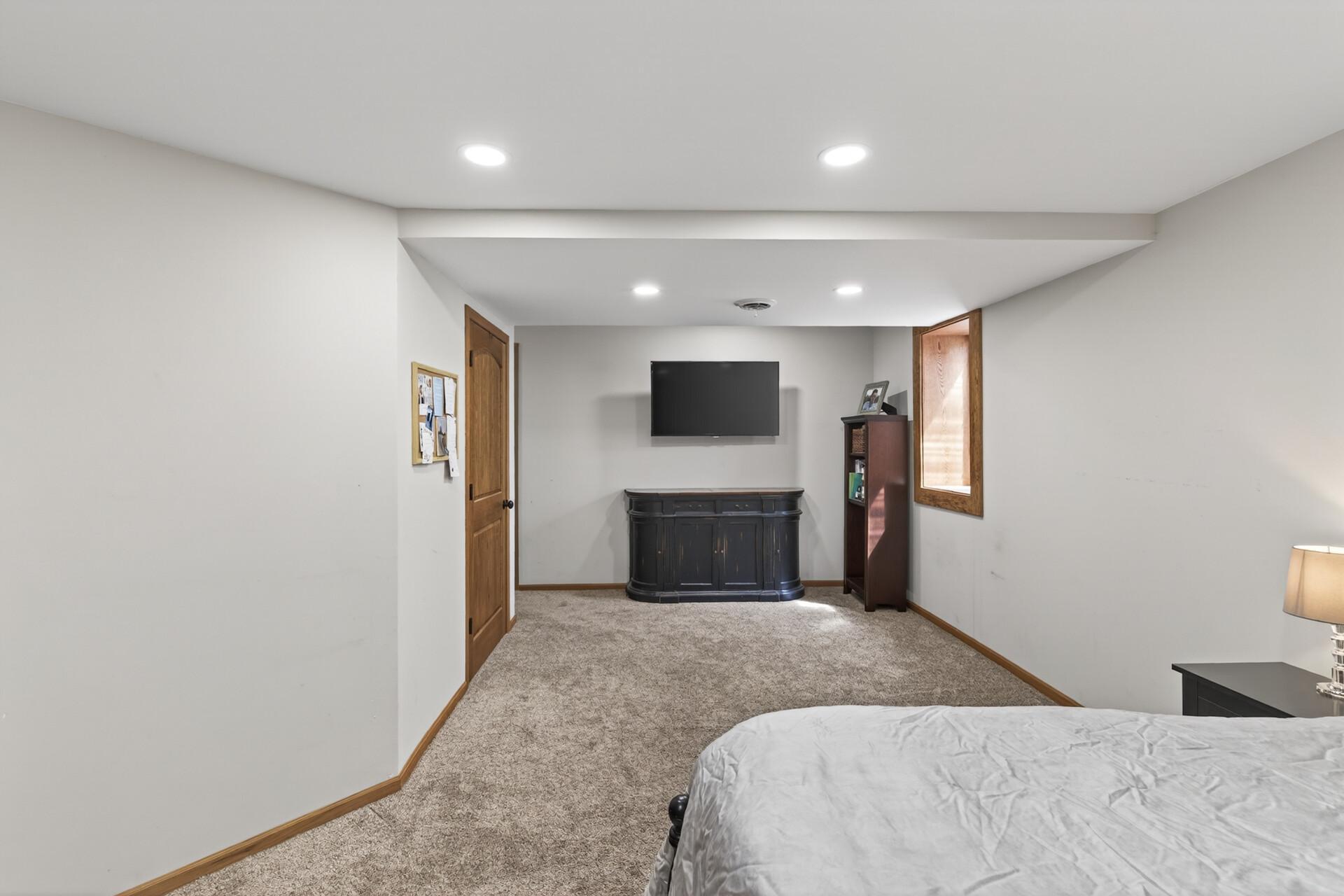 Lowest level currently used as the 5th bedroom (has an egress window). There is a walk-in closet plus storage, laundry room & a separate mechanical room.