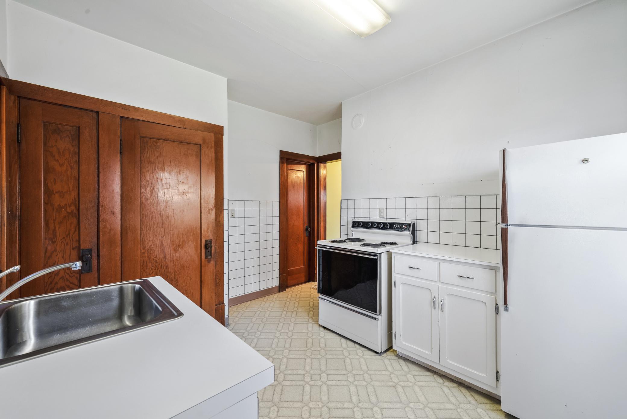 The kitchen includes a pantry area and functional layout ready for your personal touch.