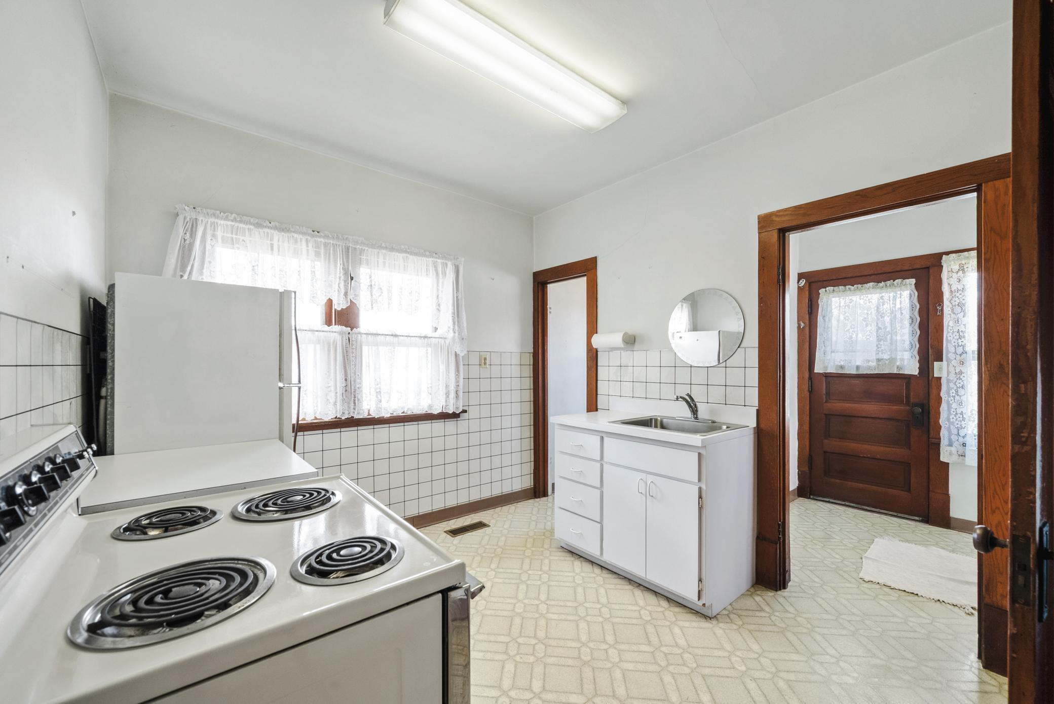 The kitchen includes a pantry area and functional layout ready for your personal touch.