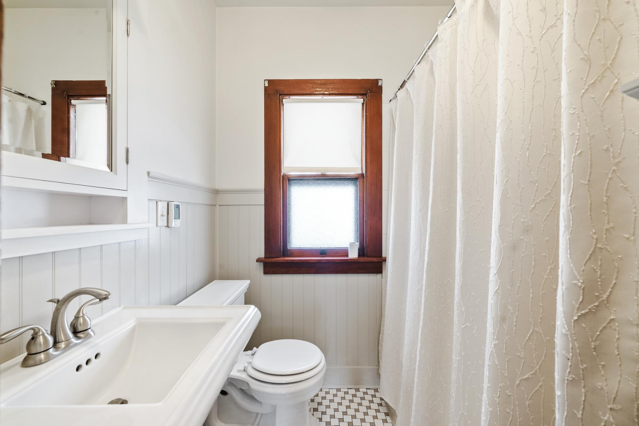 Two main-level bedrooms and a remodeled full bath with in floor heat provide convenient living.