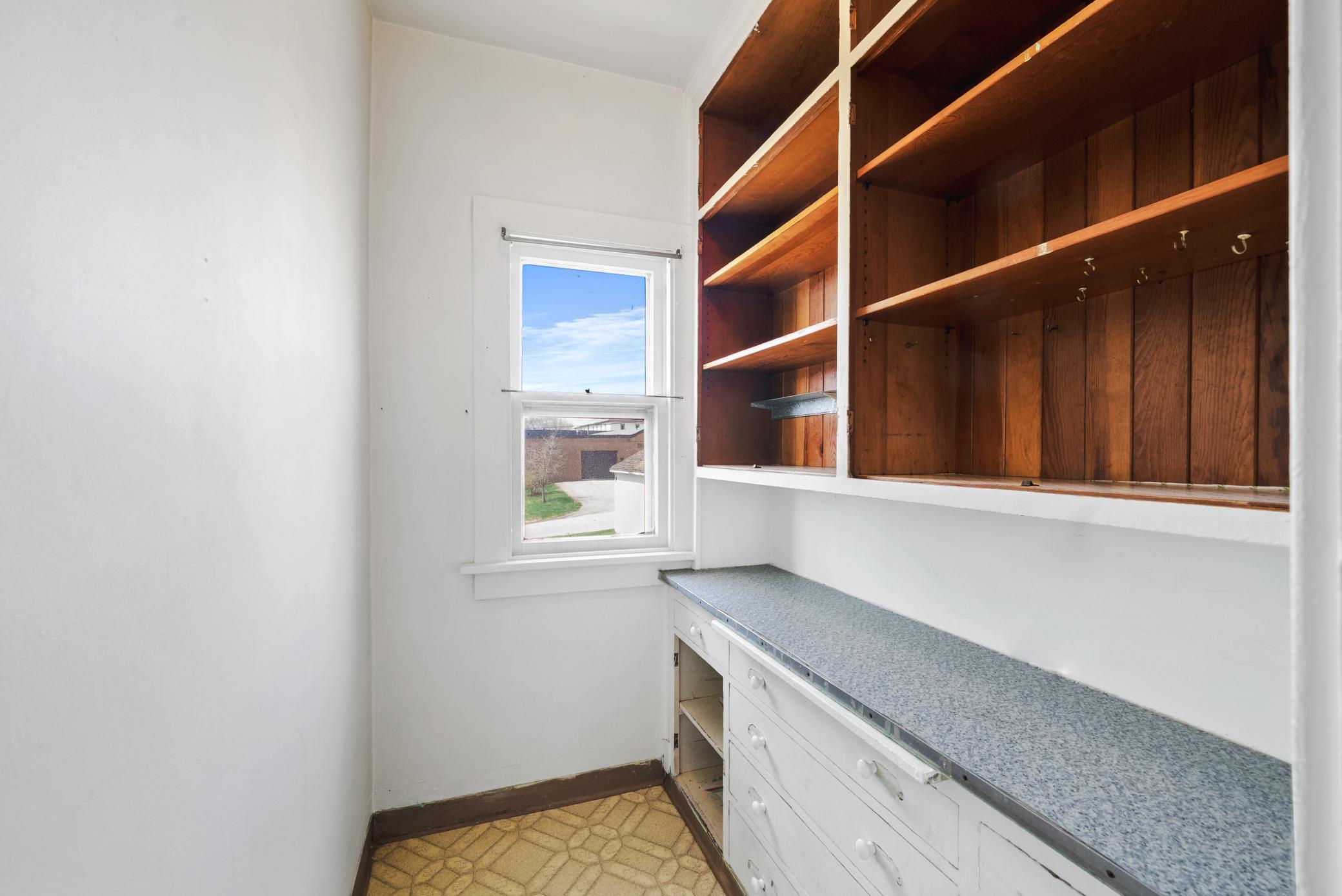 The kitchen includes a pantry area and functional layout ready for your personal touch.