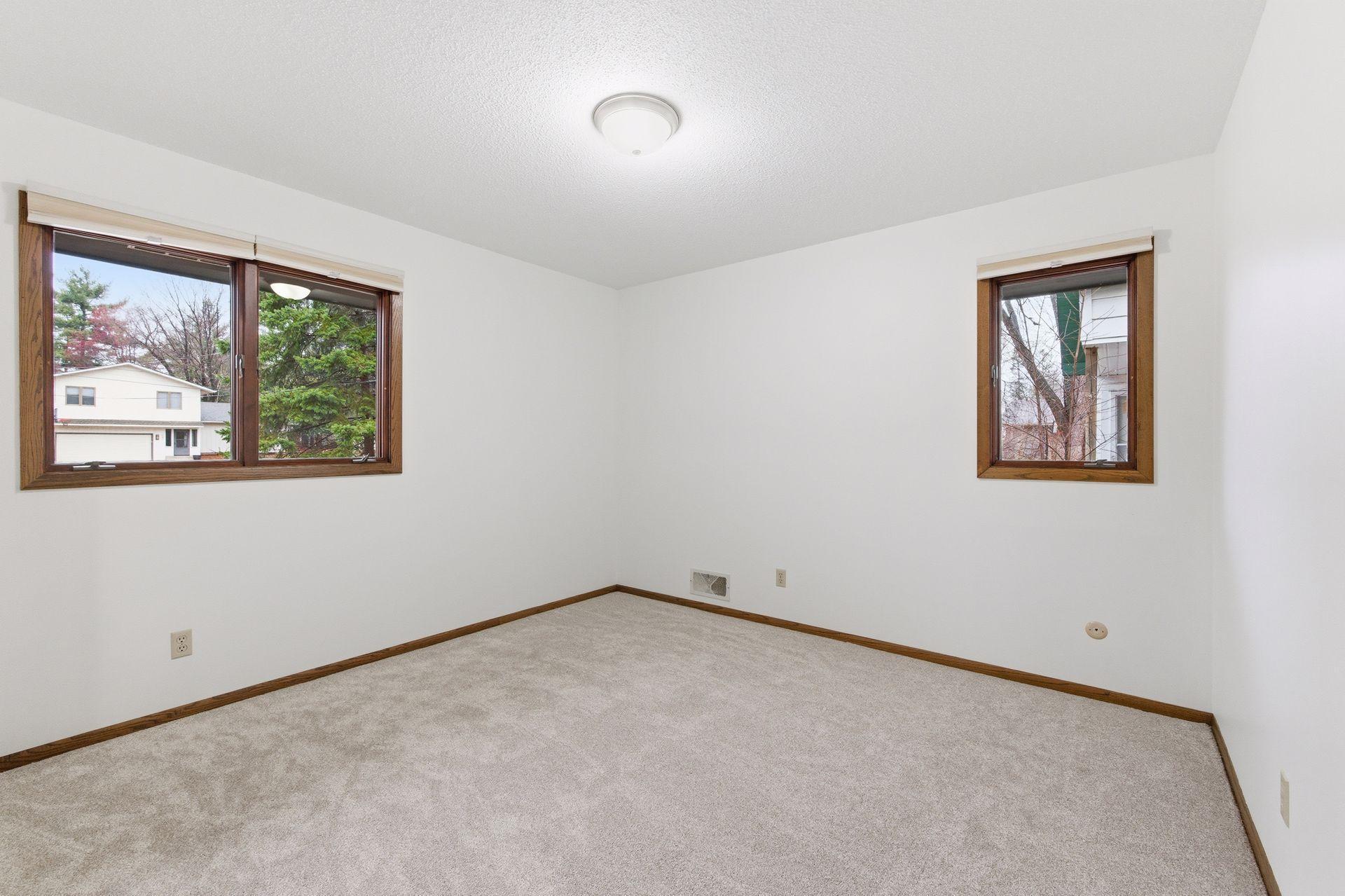 One of three main floor bedrooms all brand new carpet, paint and blinds.