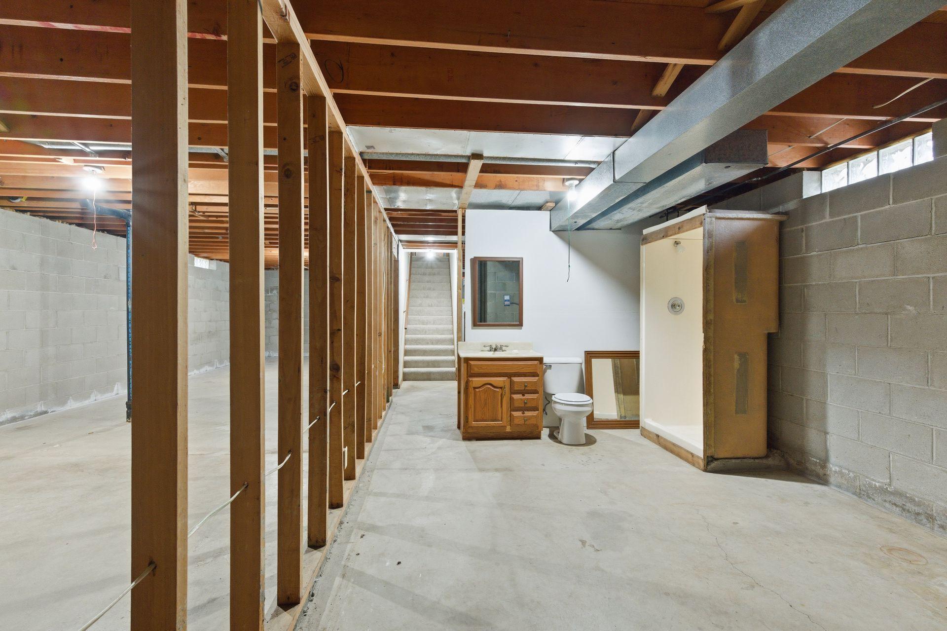 Plumbing in place for a bath along with framing for the family room wall.