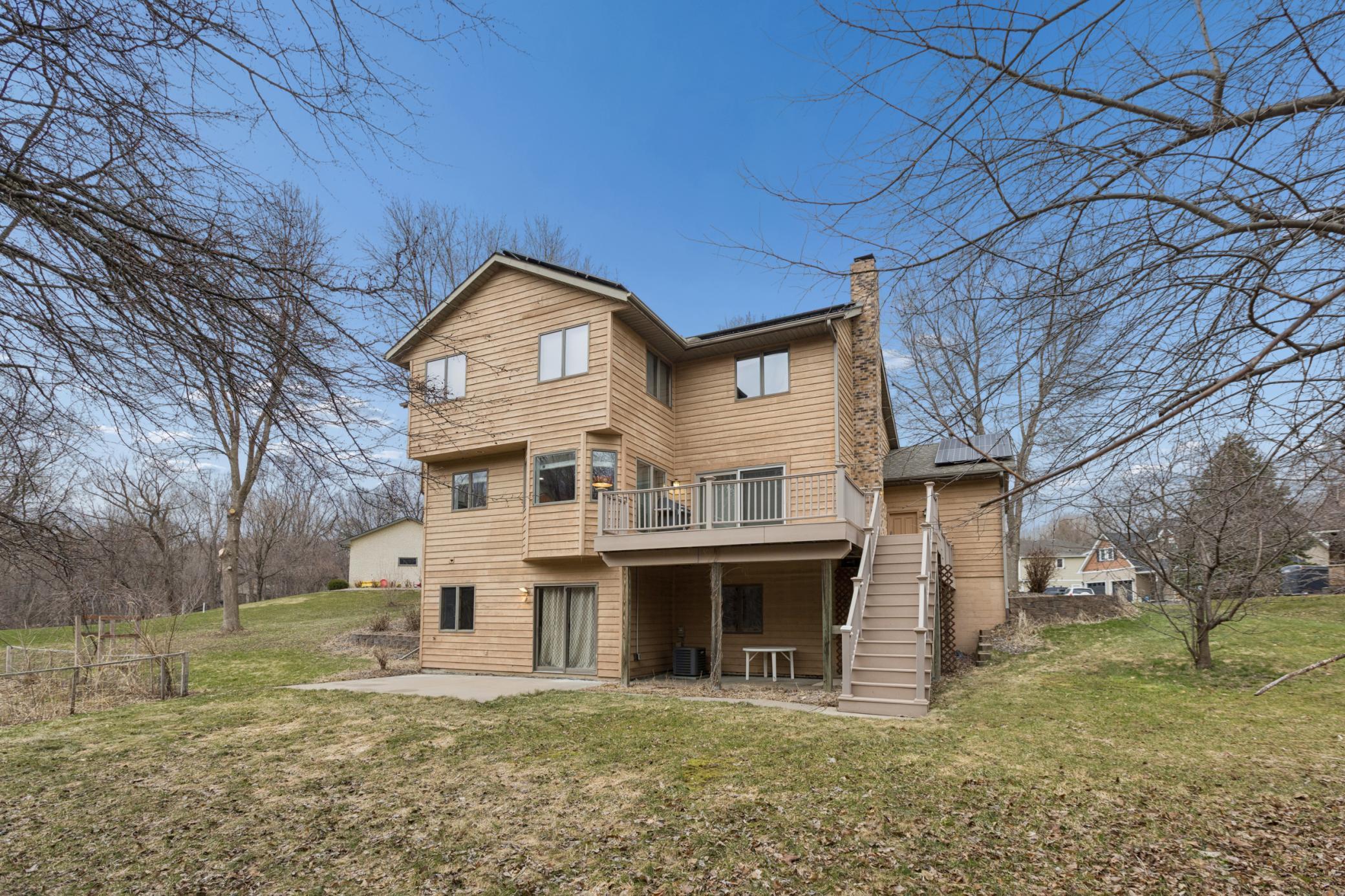 Just look at the size of this home! Wrap around deck into the garage service door and stairs to the backyard.