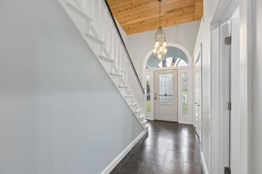 Elegant Foyer welcomes you upon entering showing off a stunning Chandelier