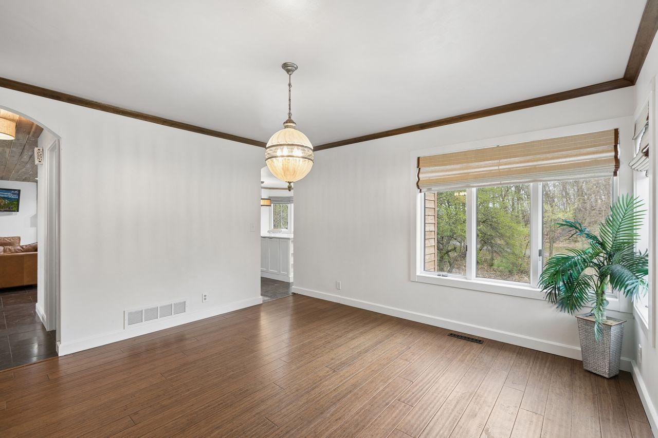 The formal dining room overlooks the backyard and flows seamlessly into the upgraded, modern kitchen