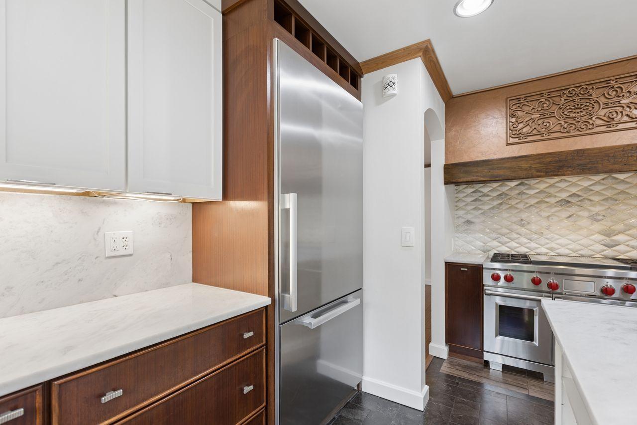 Top-of-the-line built-in luxury refrigerator, creating a true Chef’s kitchen, perfect for gourmet cooking and entertaining.