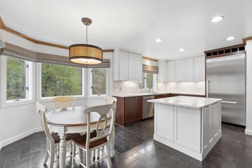 A plethora of white cabinets and recessed lighting