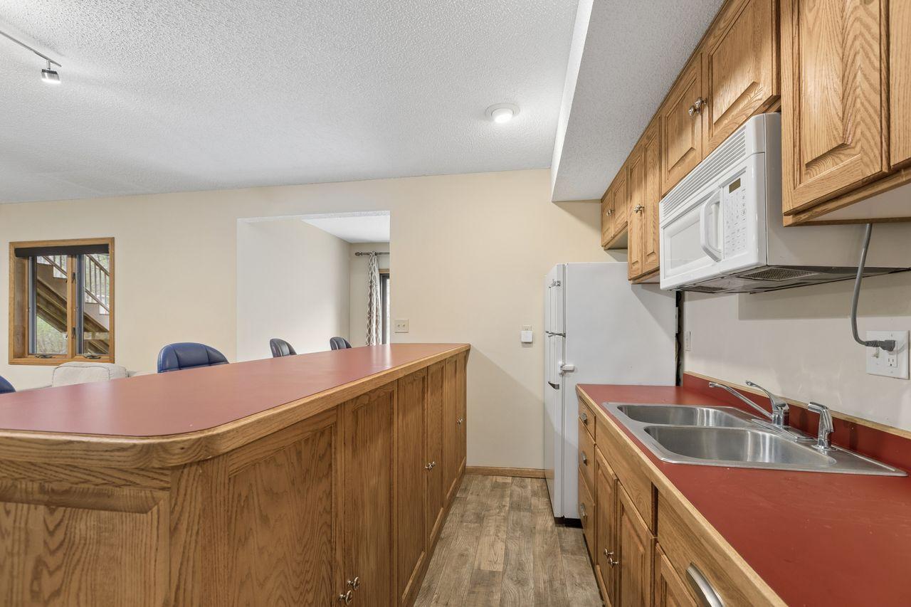 Includes a microwave, full-size refrigerator, sink.