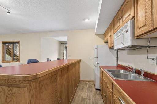 Includes a microwave, full-size refrigerator, sink.