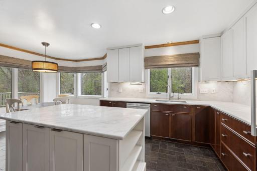 Window above the sink frames picturesque south-facing views