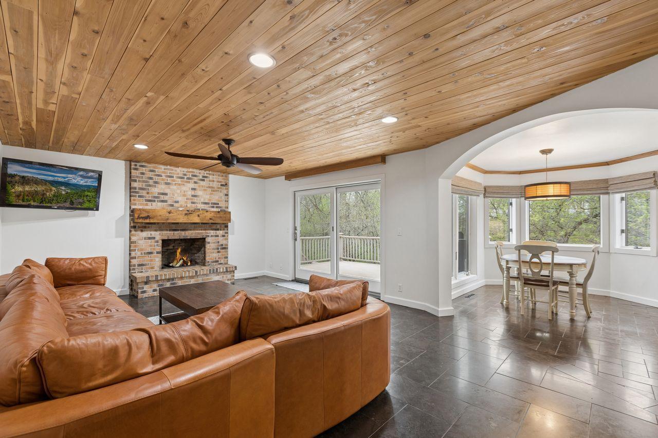 Brick surround gas fireplace that serves as a natural focal point for everyday living and entertaining.