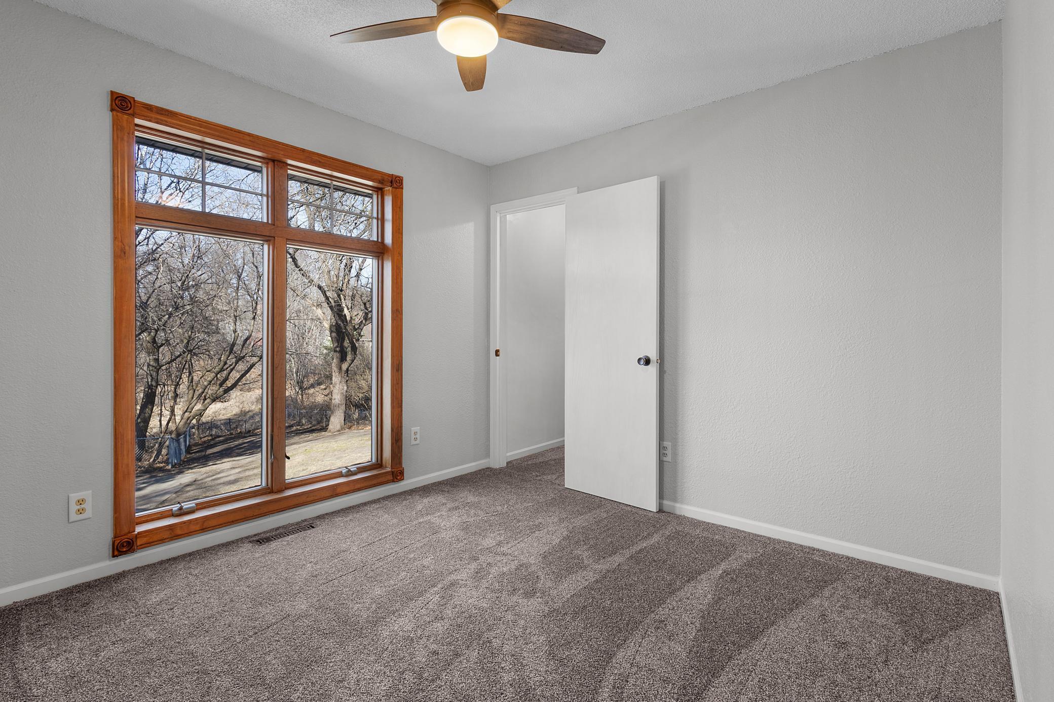 Large bedroom with huge window