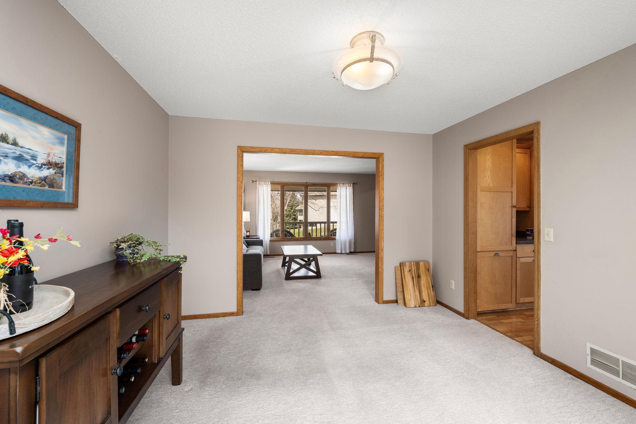 Dining room looking back towards living room and entrance to kitchen.