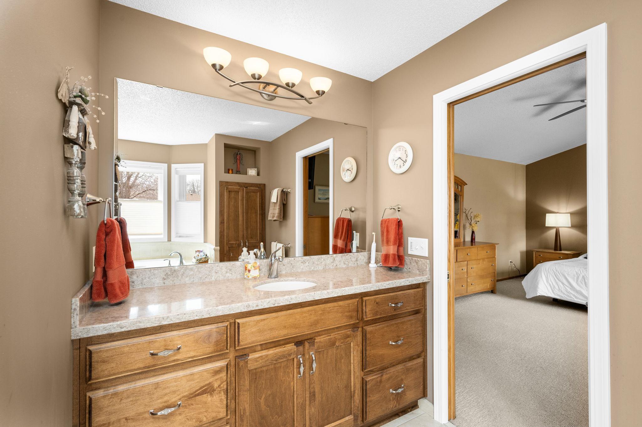 Gorgeous cabinets in this updated owner's bathroom. It really pops!