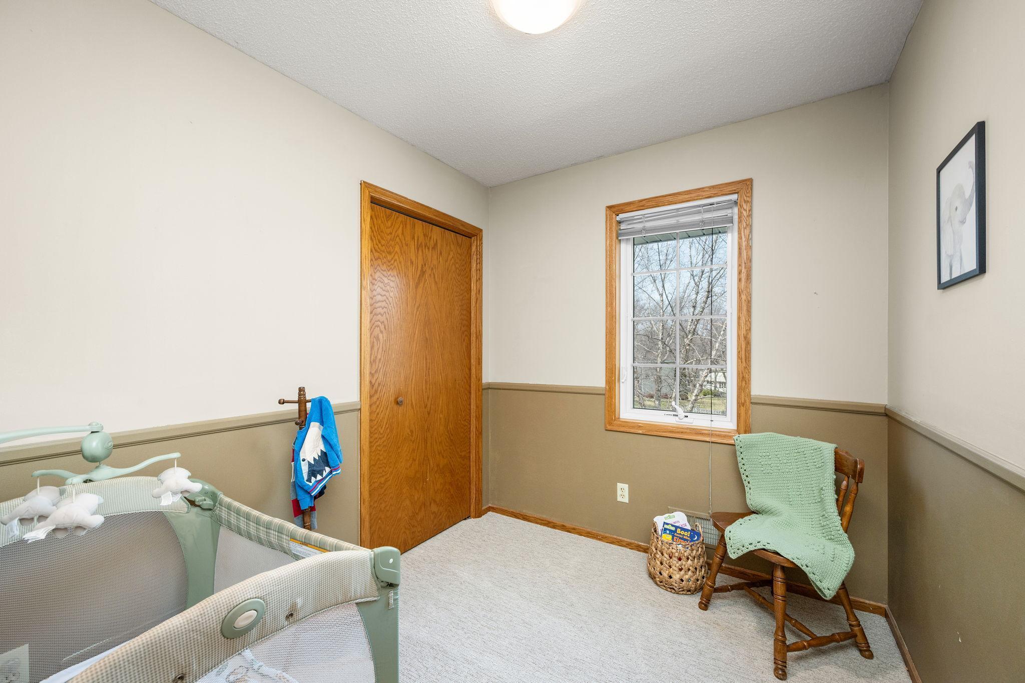 Cute 4th bedroom that is a perfect nursery, office or craft room.