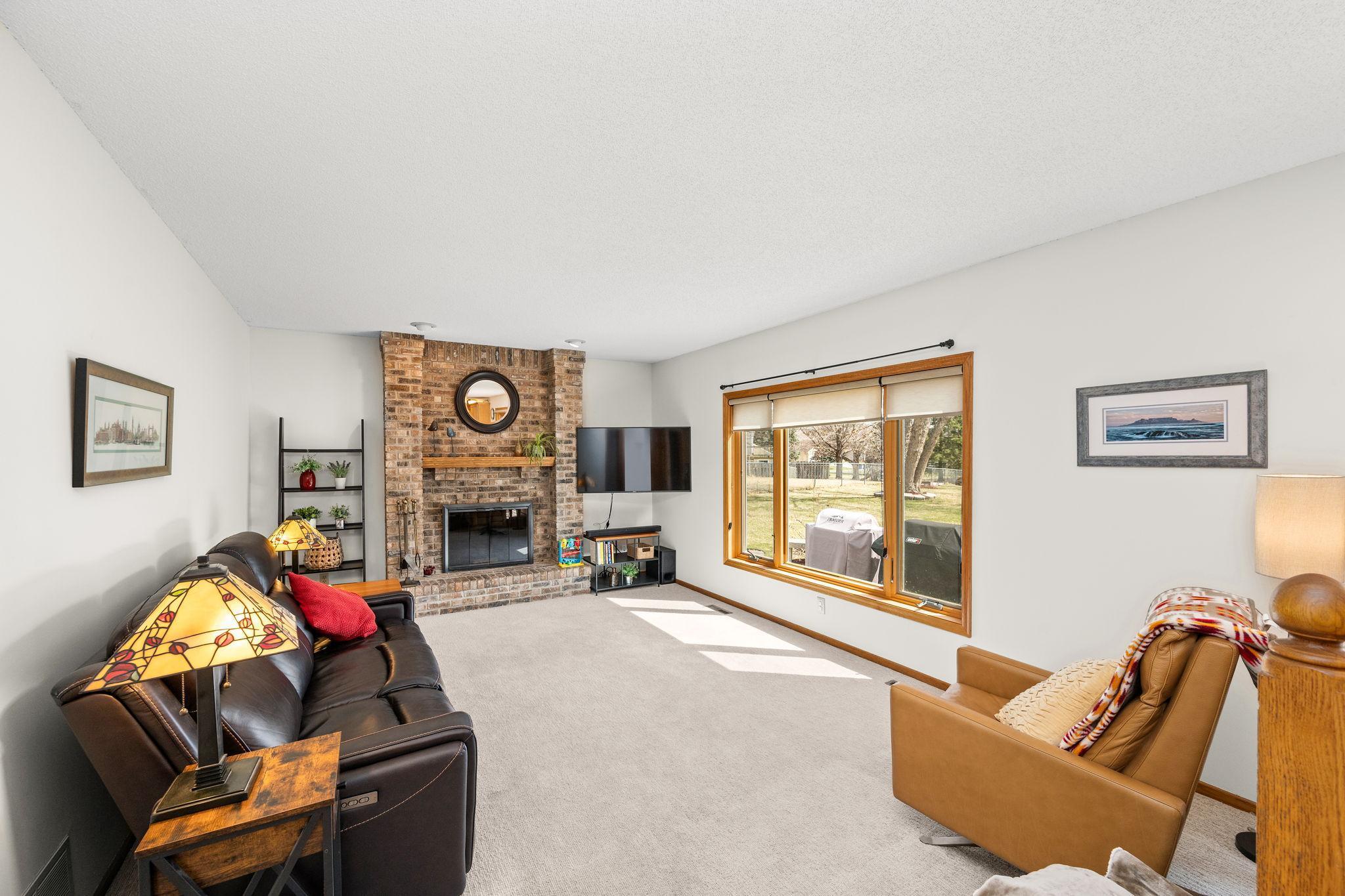 Spacious family room and cozy fireplace.