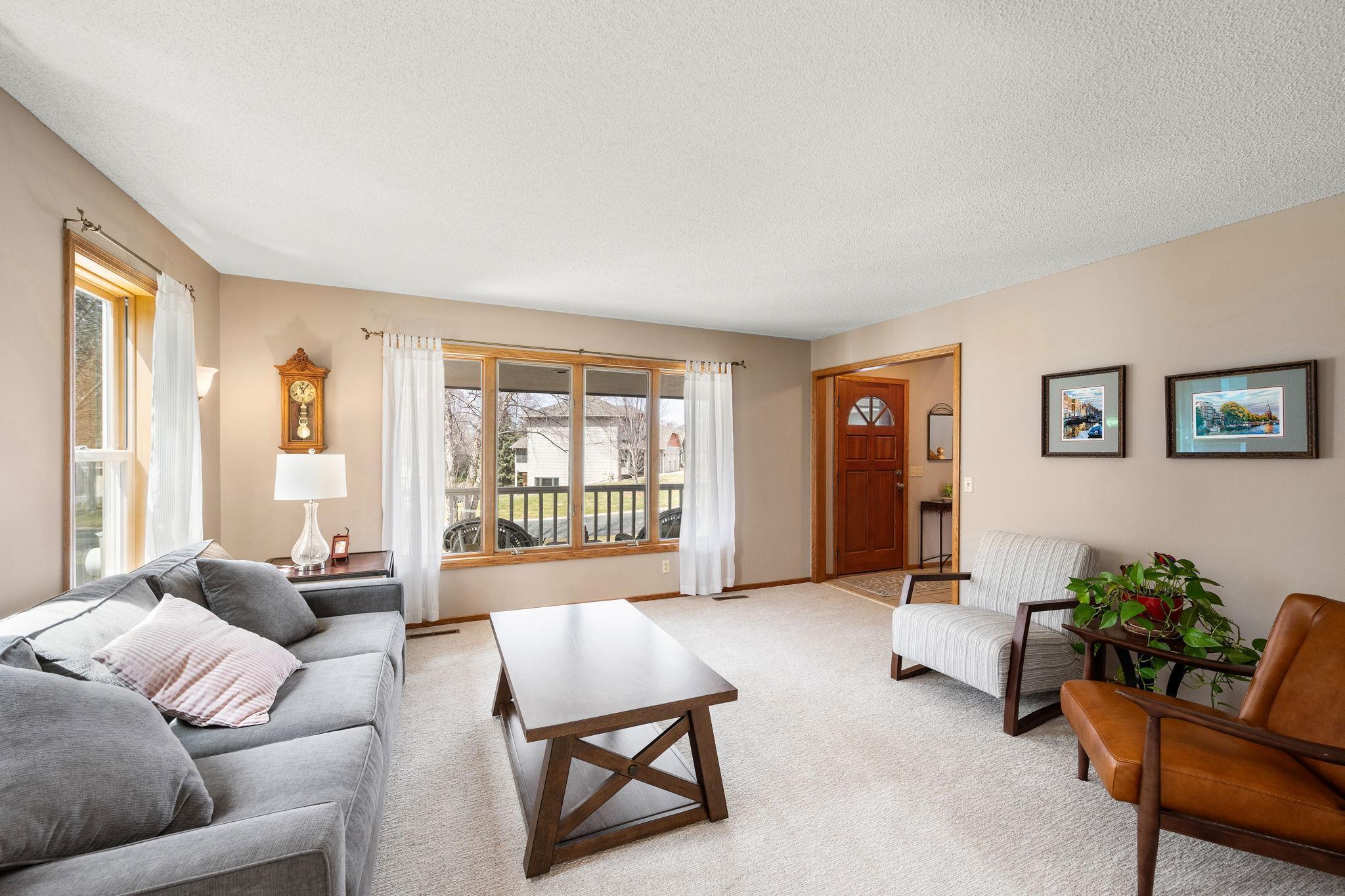 Sun-splashed spacious living room with natural light coming in from West and South.