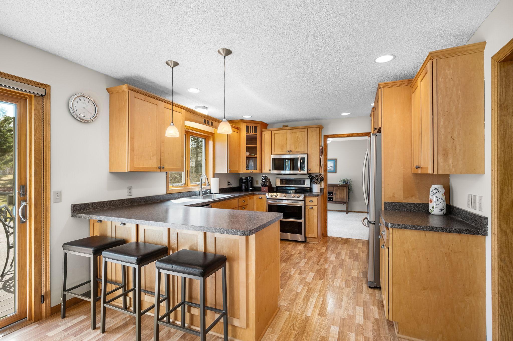 Large, well-designed kitchen with gorgeous maple cabinets and loads of storage!