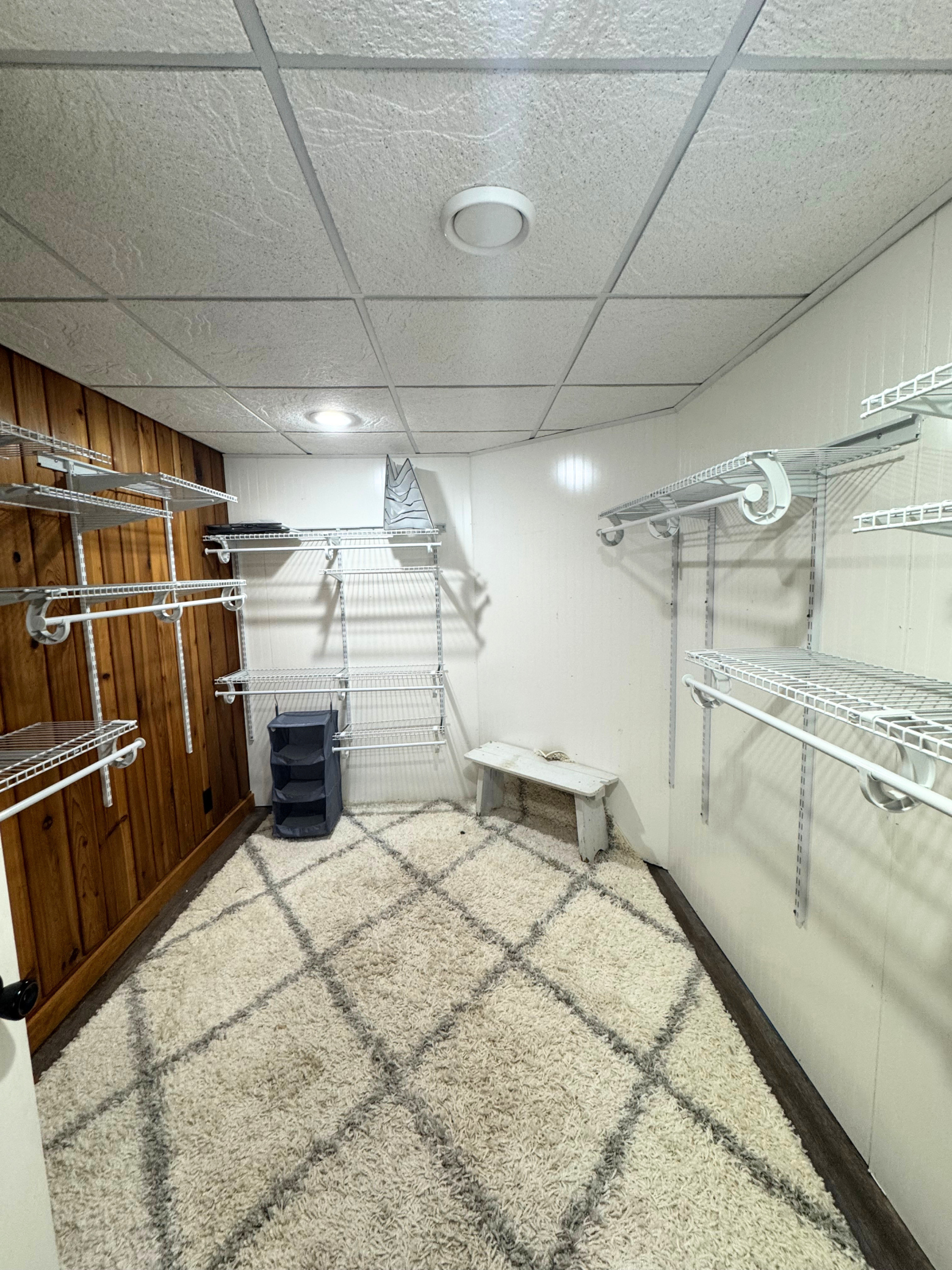 Primary bedroom walk in closet 11X8