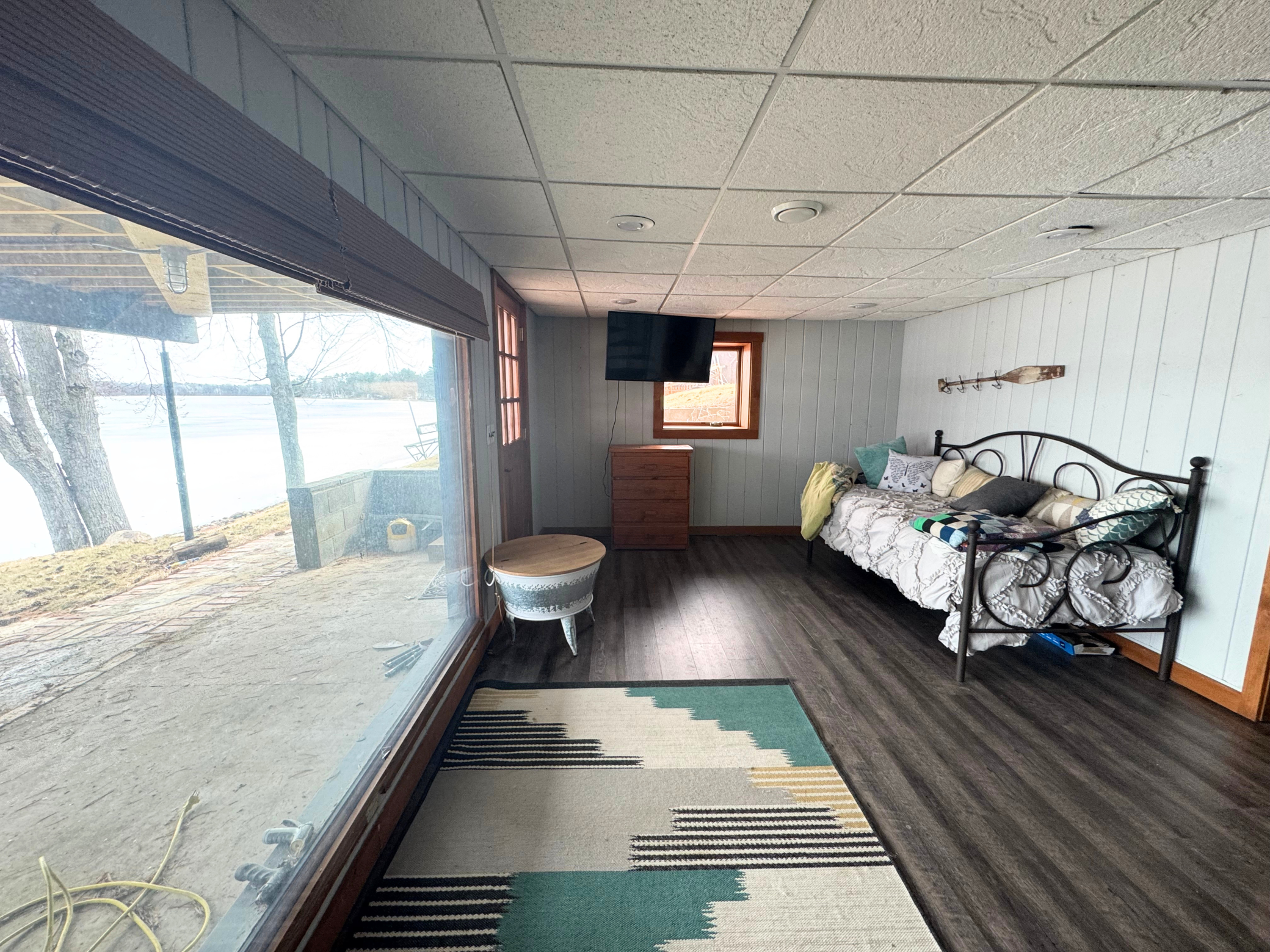 Walk out to covered patio area and lake. Family room or additional sleeping space!