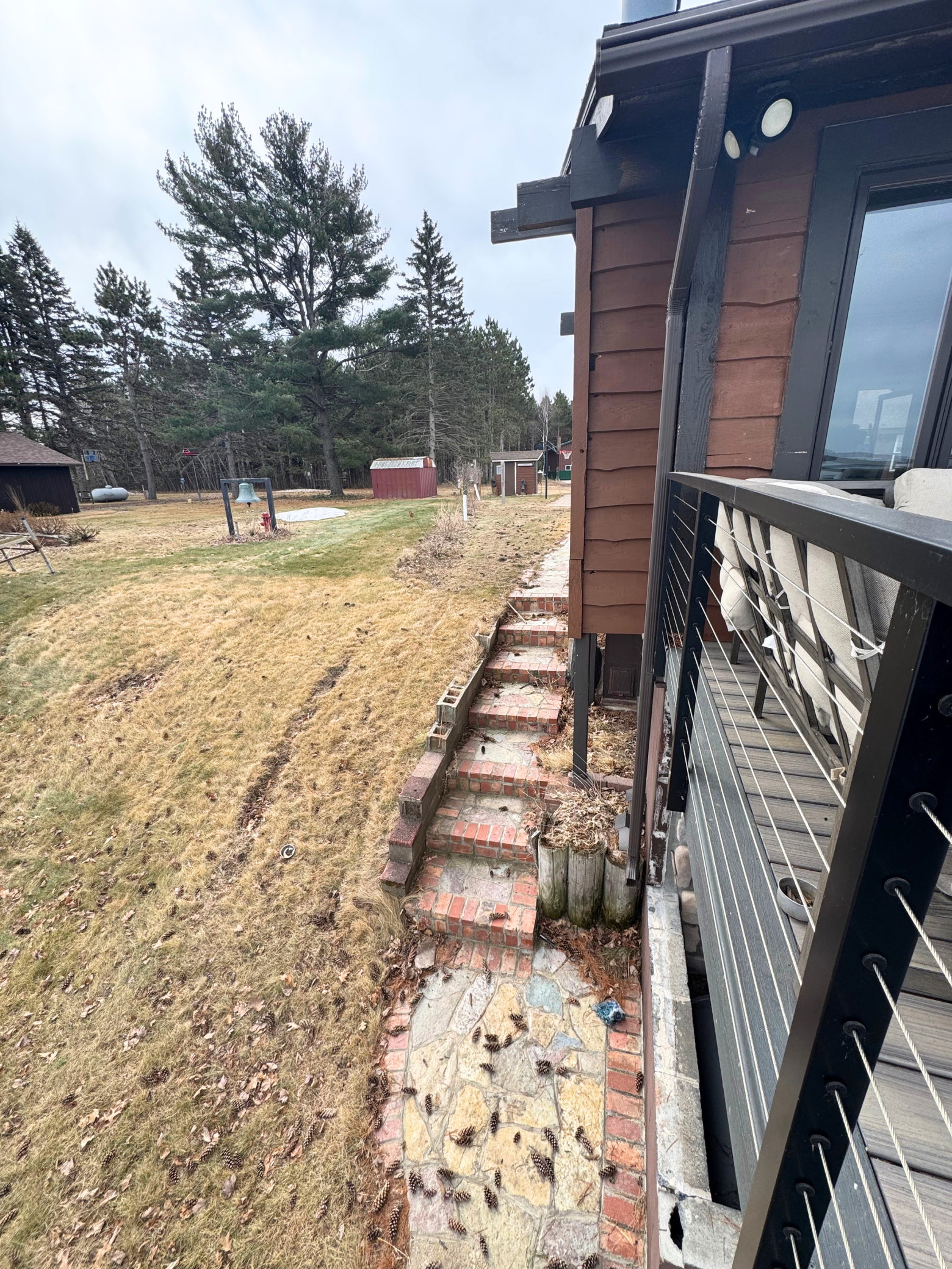 Stairway to covered patio and hot tub, access to lower level of home.