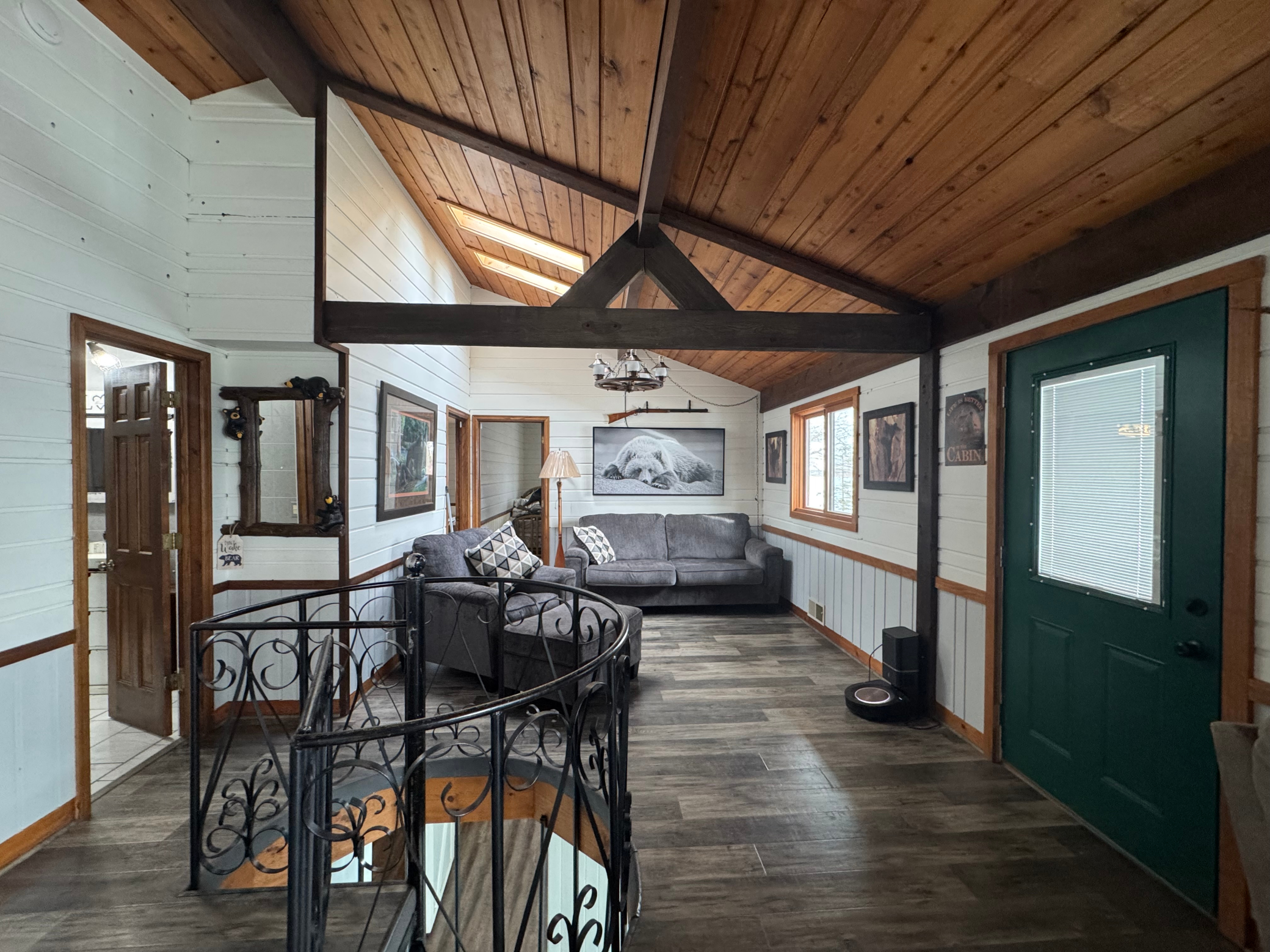 Main level open concept area with stairway to lower level walk out.