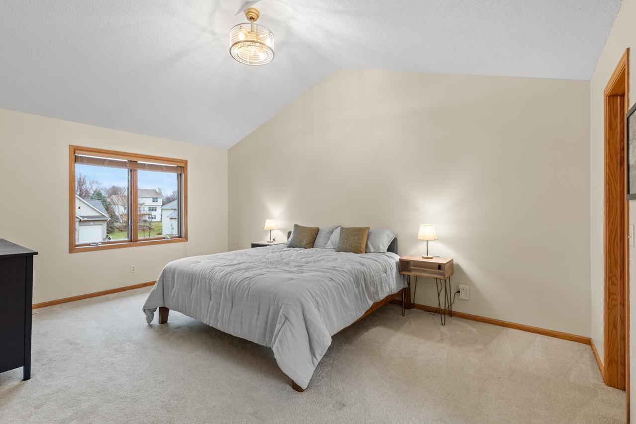 Large primary bedroom suite with vaulted ceiling - flows into a large bathroom and walk-in closet