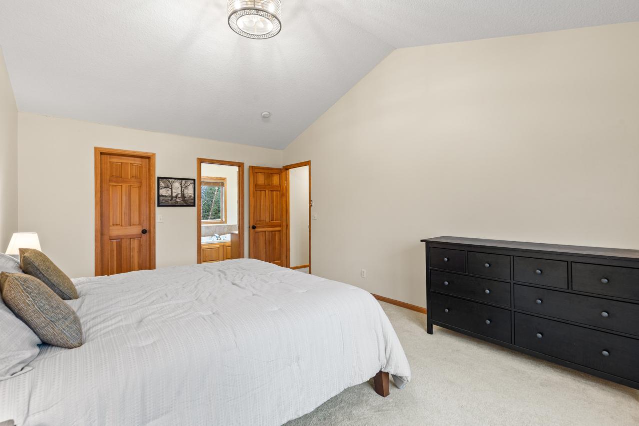 Spacious Primary bedroom with an ensuite bathroom and a walk-in closet