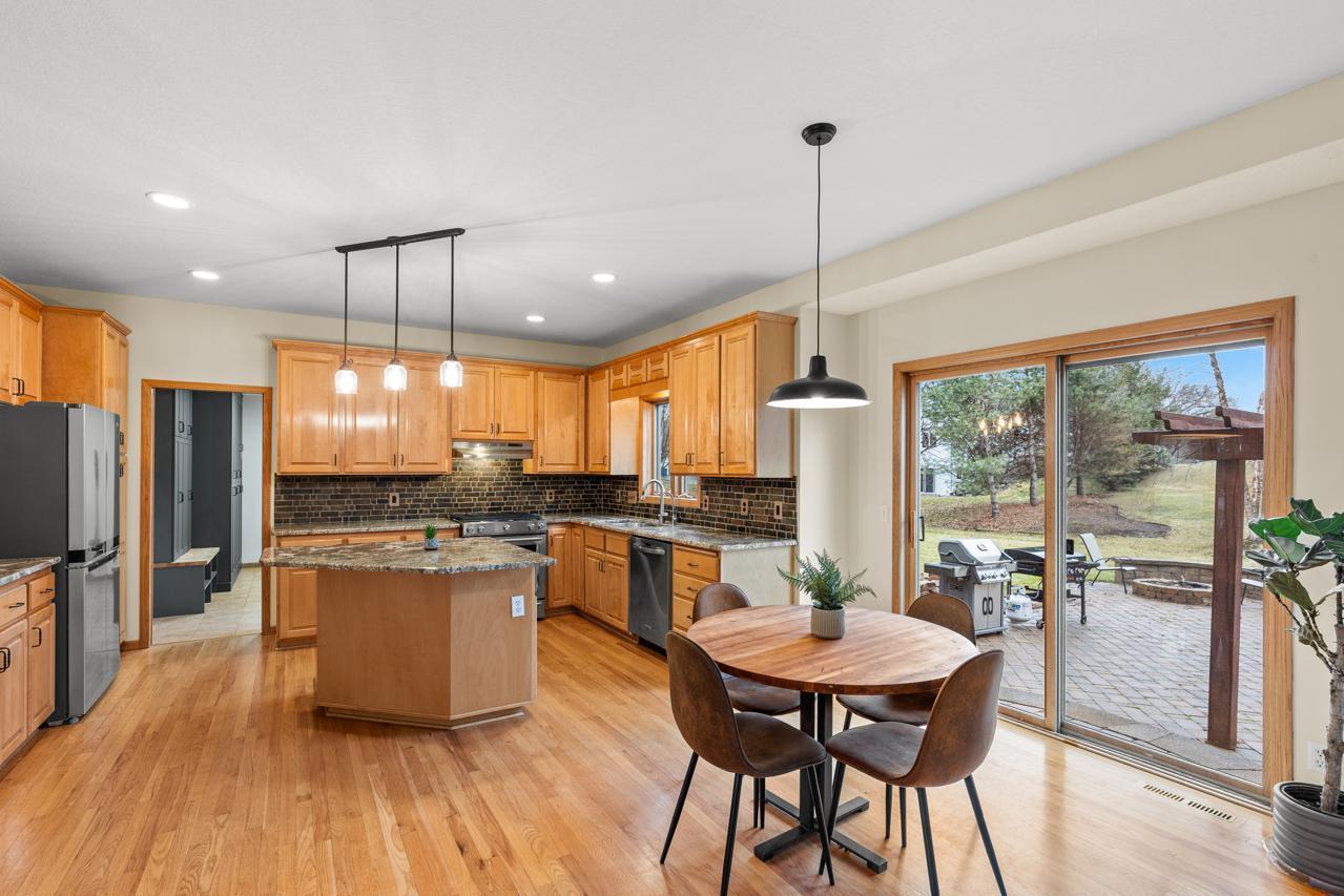 Informal dining area opens up to large patio