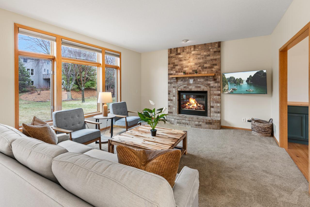 Cozy Living Room with Gas fire-place and large windows to the back yard