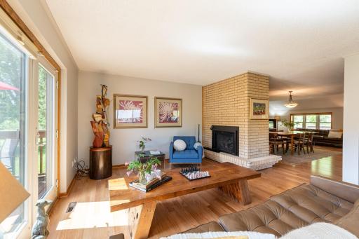 The newer double-sided gas fireplace creates a cozy atmosphere while beautifully connecting the conversation room with the adjoining dining room.