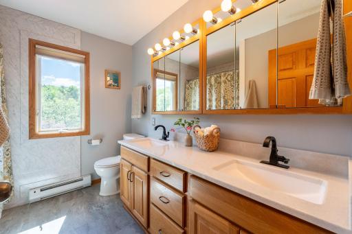 Full bathroom on the upper level was remodeled by the prior owners and features double sinks.